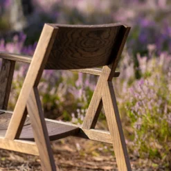 98.6°F Outdoor Lounge Chair Single Arm By Lyndon Neri And Rossana Hu -Finest Furniture Shop 98.6 FOutdoorOneArmedLoungeChairbyNeri HuinblackoiledEuropeanoak detail photobyCarlosTeixeira